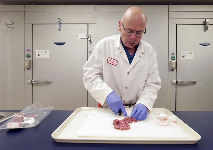 In this Oct. 1, 2015, photo, meat scientist Bob Danler prepares a sample of ground beef for testing at GreatO Premium Foods in Manhattan, Kan. The company is marketing beef with omega-3 fatty acids from cattle fed flaxseed with an eye to offering health-conscious consumers another wholesome dinner choice. (AP Photo/Charlie Riedel)