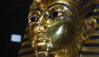 In this Saturday, Jan. 24, 2015, file photo, the gold mask of King Tutankhamun is seen in its glass case during a press tour, in the Egyptian Museum near Tahrir Square, Cairo, Egypt. The restoration of King Tutankhamun&#x27;s world-famous golden mask will begin Saturday, over a year after the beard was accidentally broken off and hastily glued back with epoxy, Egypt&#x27;s state-run news agency said Friday. (AP Photo/Hassan Ammar, File)