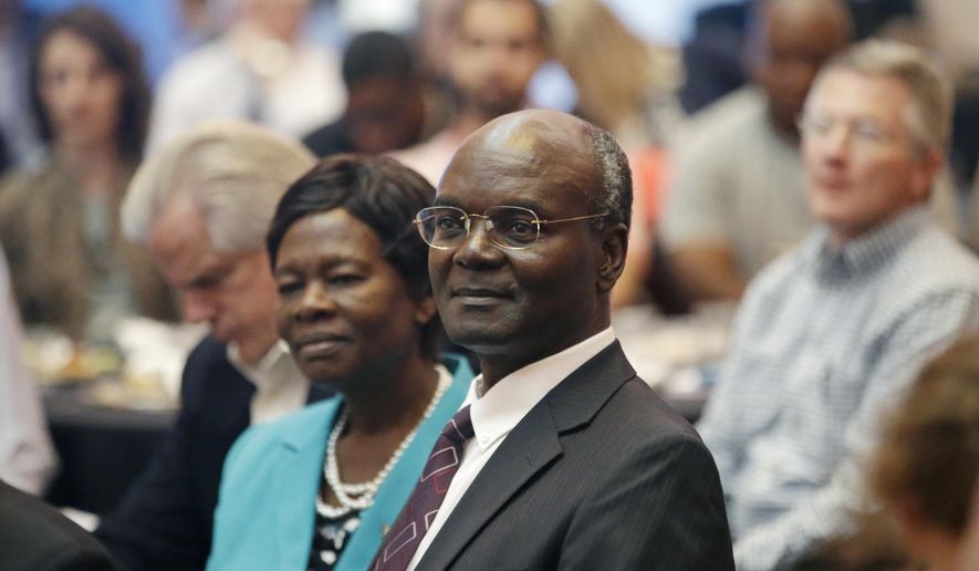 Joseph W. Sitati, of Kenya, one of the highest-ranking black Mormon leaders, looks on after speaking at a conference at University of Utah Friday, Oct. 9, 2015, in Salt Lake City. Sitati says Latter-day Saints in Africa are at peace with the religion&#x27;s past ban on the lay priesthood. Sitati, of a second-tier Mormon governing body called the Quorum of the Seventy, said the number of Mormons in Africa has increased to nearly 449,000 in 2014, up from 7,600 in 1978. (AP Photo/Rick Bowmer)