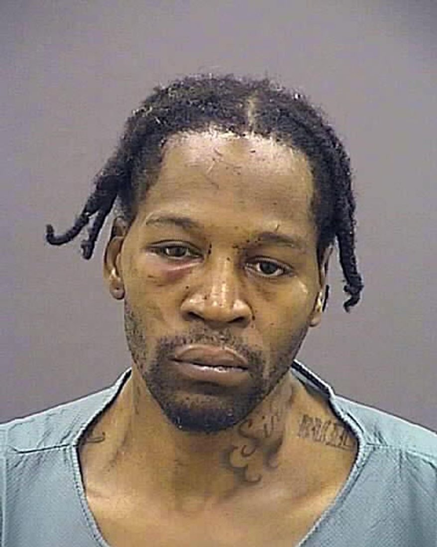 This Thursday, Oct. 8, 2015, photo made available by the Baltimore Police Department shows Dontae Small. Small, 41, has been charged with armed robbery, assault and various gun charges from an incident that occurred on Oct. 4, 2015 in south Baltimore. (Baltimore Police Department via AP)