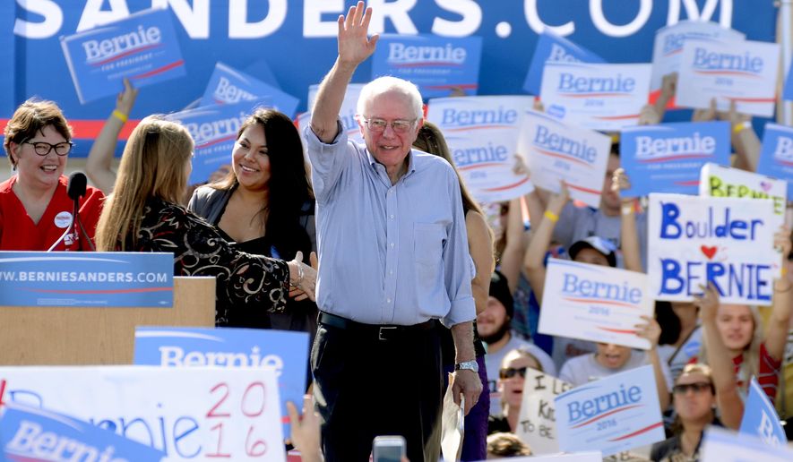 Democratic presidential candidate Sen. Bernie Sanders of Vermont waves to the crowd as he arrives on the stage at the University of Colorado campus in Boulder, Colo., on Saturday, Oct. 10, 2015. (Cliff Grassmick/Daily Camera via AP)