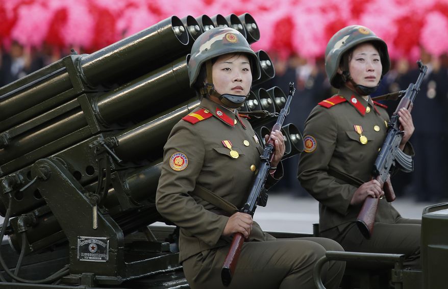 North Korean soldiers parade through Kim Il Sung Square with their missiles and rockets during a mass military parade, Saturday, Oct. 10, 2015, in Pyongyang, North Korea. North Korean leader Kim Jong Un declared Saturday that his country was ready to stand up to any threat posed by the United States as he spoke at a lavish military parade to mark the 70th anniversary of the North's ruling party and trumpet his third-generation leadership. (AP Photo/Wong Maye-E)