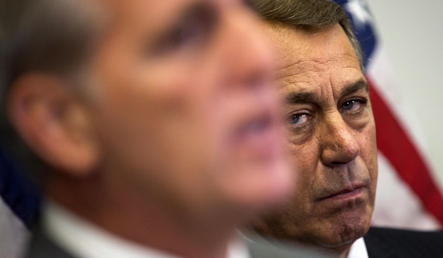 In this Oct. 7, 2015, photo, outgoing House Speaker John Boehner of Ohio listens at right as House Majority Leader Kevin McCarthy of Calif., speaks during a new conference on Capitol Hill in Washington. Boehner wants out. He really does. But the Ohio House Republican is staying put, for now _ and that could improve the chances for a debt limit increase by early next month to avoid a market-shattering government default and possibly a bipartisan budget deal to head off a government shutdown in December. Conservative hardliners have already forced Boehner to announce he’s leaving and then caused further chaos by blocking the ascension of McCarthy. (AP Photo/Evan Vucci)