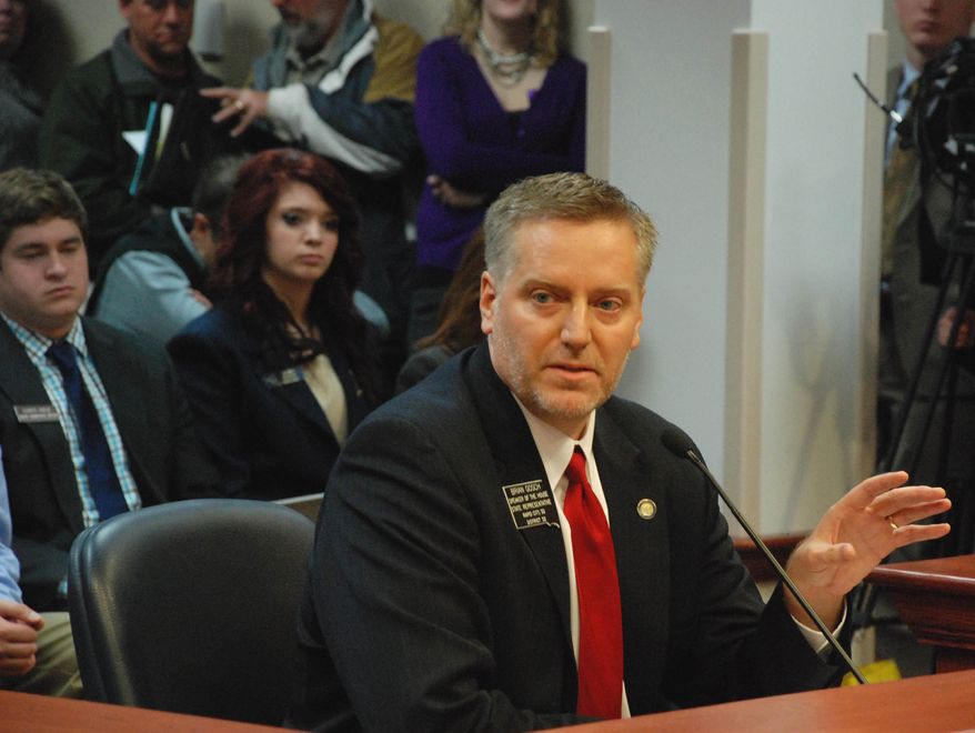 South Dakota House Speaker Brian Gosch, R-Rapid City, talks Wednesday, Feb. 5, 2014, in Pierre, S.D., about his proposal to ban texting while driving statewide. The House Judiciary Committee delayed a vote on the measure until Monday. (AP Photo/Chet Brokaw)