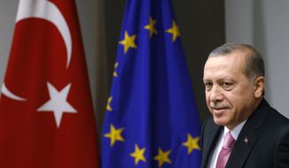 Critics say Turkish President Recep Tayyip Erdogan is orchestrating the government&#39;s deeply unpopular policies, such as stepping up military actions against Kurdish forces and cracking down on the media and opposition groups. (Associated Press)