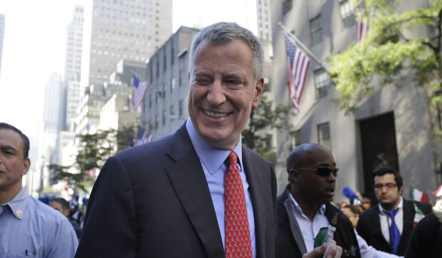 New York City Mayor Bill de Blasio winks at someone during the Columbus Day Parade in New York, Monday, Oct. 12, 2015. Approximately 35,000 marchers participated in the annual celebration of Italian-American culture. (AP Photo/Seth Wenig) ** FILE **