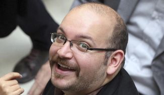 FILE - In this photo April 11, 2013 file photo, Jason Rezaian, an Iranian-American correspondent for the Washington Post, smiles as he attends a presidential campaign of President Hassan Rouhani in Tehran, Iran. Iran&#39;s official IRNA news agency reported that the verdict against Rezaian has been issued. Rezaian, the Post&#39;s Tehran bureau chief, is accused of charges including espionage in a closed-door trial that has been widely criticized by the U.S. government and press freedom organizations. (AP Photo/Vahid Salemi, File)