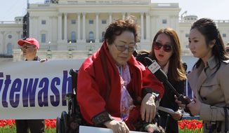Yong Soo Lee, of South Korea speaks to reporters on the West Lawn of Capitol Hill in Washington, Tuesday, April 28, 2015, Yong Soo Lee is one of dozens of surviving &quot;comfort women&quot; from Korea other Asian countries that were forced into sexual servitude by Japanese troops. (AP Photo/Luis M. Alvarez)