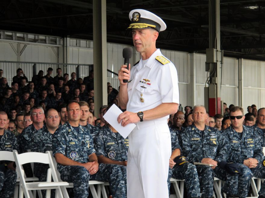 Navy Adm. John Richardson speaks to sailors in Pearl Harbor, Hawaii on Tuesday, Oct. 13, 2015. The Navy's top officer says the service is considering extending paternity leave for new fathers. (AP Photo/Audrey McAvoy)
