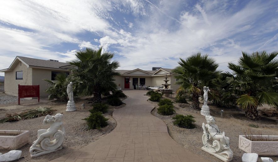 The entrance to the Love Ranch brothel is seen, Wednesday, Oct. 14, 2015 in Crystal, Nev., were former NBA basketball player Lamar Odom was found unconscious the day before. Odom, the NBA star and reality TV personality embraced by teammates and fans for his humble approach to fame, was on life support Wednesday, his estranged wife Khloe Kardashian by his side. Odom was found unresponsive after four days at the brothel (AP Photo/Chris Carlson)