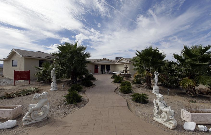 The entrance to the Love Ranch brothel is seen, Wednesday, Oct. 14, 2015 in Crystal, Nev., were former NBA basketball player Lamar Odom was found unconscious the day before. Odom, the NBA star and reality TV personality embraced by teammates and fans for his humble approach to fame, was on life support Wednesday, his estranged wife Khloe Kardashian by his side. Odom was found unresponsive after four days at the brothel (AP Photo/Chris Carlson)