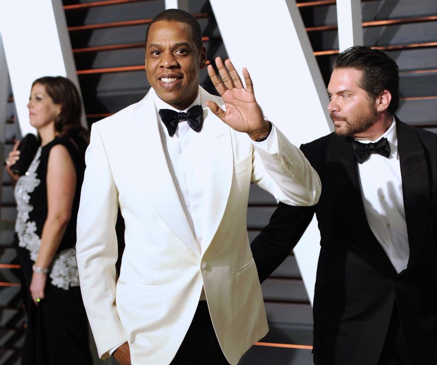 FILE - In this Feb. 23, 2015 file photo, Jay Z arrives at the 2015 Vanity Fair Oscar Party in Beverly Hills, Calif. The rapper appeared in a Los Angeles federal court on Tuesday, Oct. 13, 2015, for the start of a copyright infringement trial in which he and music producer Timbaland are accused of violating the rights of famed Egyptian composer Baligh Hamdi to create their 1999 hit "Big Pimpin'." (Photo by Evan Agostini/Invision/AP, File)