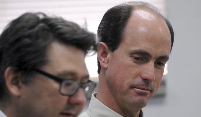 In this July 9, 2015, photo, Seth Jeffs, right, the brother of Warren Jeffs, the imprisoned leader of a polygamist sect, participates in a state water board meeting in Pierre, S.D. South Dakota regulators approved Wednesday, Oct. 14, 2015, the secretive polygamist group's request to draw water more quickly at its Black Hills compound even though the sect declined to provide many details about how many people live there. (AP Photo/James Nord, File)