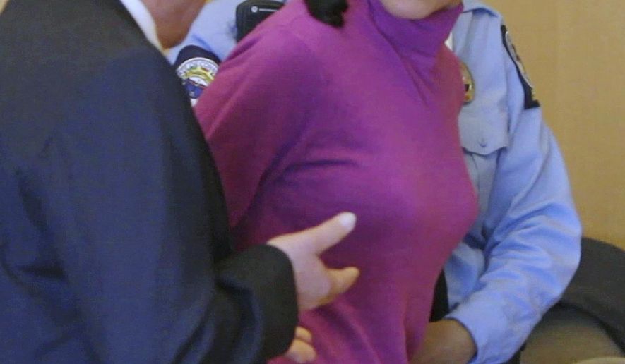 FILE - In this April 27, 2012 file photo, Sheila Davalloo looks back at Superior Court in Stamford Conn., following her sentencing for the 2002 murder of Anna Lisa Raymundo. Connecticut's Supreme Court is scheduled to hear arguments Wednesday, Oct. 14, 2015, to decide whether there are legal limits to the confidentiality of a conversation between a married couple. Her husband Paul Christos testified during her murder trial that she had frequently told him stories. The state Appellate Court found that the spousal privilege did not apply in this case because Davalloo's conversations with her husband were not "induced by affection, as required by the law." ( AP Photo/Matthew Brown, Pool File)