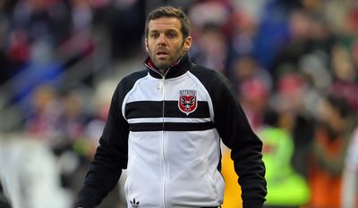 D.C. United head coach Ben Olsen looks on against the New York Red Bulls during the first half of an MLS playoff soccer match, Sunday, Nov. 2, 2014, in Harrison, N.J. (AP Photo/Adam Hunger)