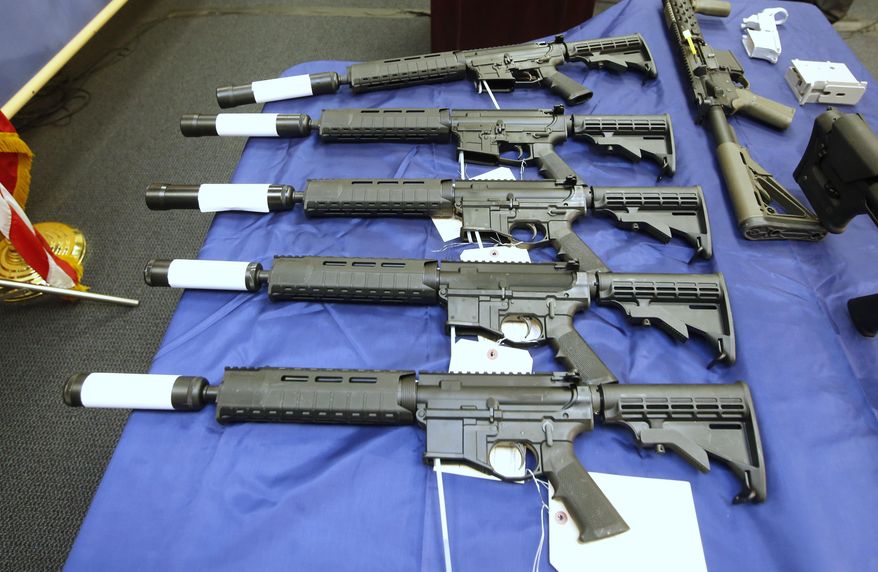 Some of the guns seized in undercover operation are displayed at a news conference in Sacramento, Calif., Thursday, Oct. 15, 2015. Benjamin Wagner, the United States Attorney for the Eastern District of California, announced the indictment of 8 men on a variety of firearm charges including the manufacturing and dealing in firearms without a license.(AP Photo/Rich Pedroncelli)