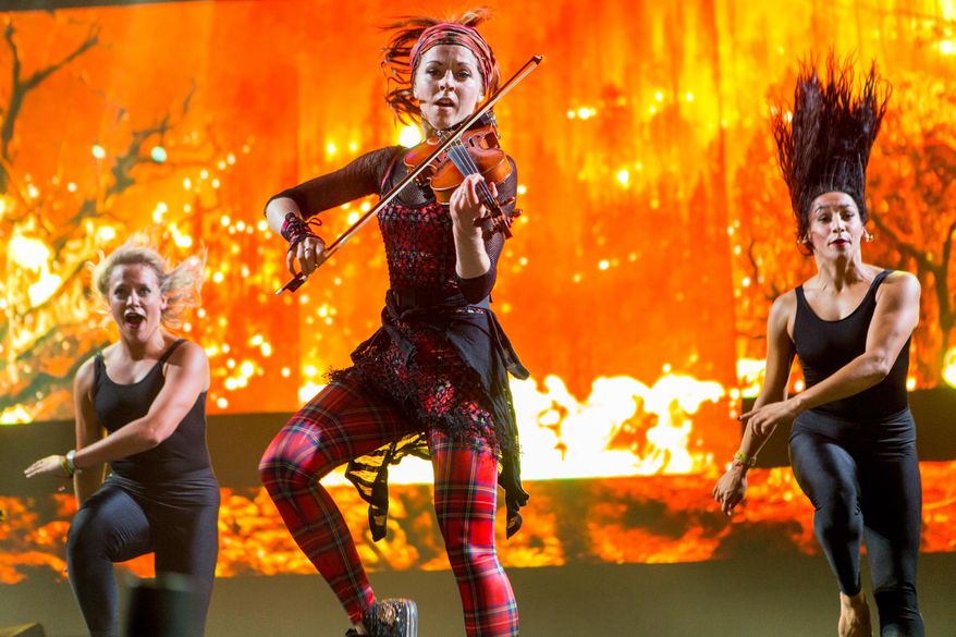 FILE - In this Sept. 25, 2015 file photo, Lindsey Stirling performs during the Life is Beautiful festival, in Las Vegas. YouTube's top-earning celebrity is Felix Kjellberg, better known by his handle "PewDiePie," a 25-year-old video-game-playing jokester who took in $12 million in the year ending June 1, 2015. Forbes magazine says he tops its first list of people who have spun short online videos into huge piles of cash. The dancing violinist Stirling ranked fourth on Forbes list with $6 million. (Photo by Paul A. Hebert/Invision/AP, File)
