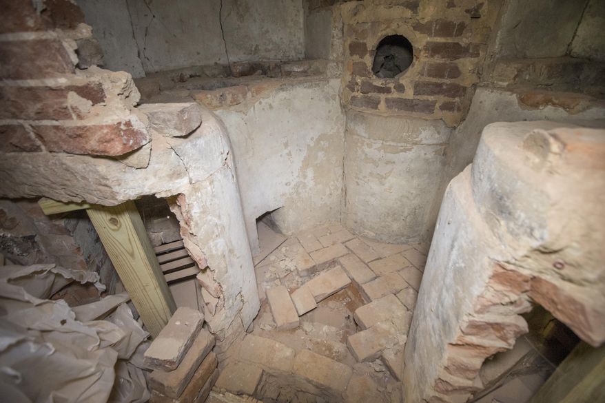 ADVANCE FOR SUNDAY OCT. 18 AND THEREAFTER - This Wednesday Sept. 23, 2015 photo provided by the University of Virginia shows a chemical hearth found in the Rotunda at the University of Virginia during a renovation at the school in Charlottesville, Va. (Dan Addison/University of Virginia via AP)