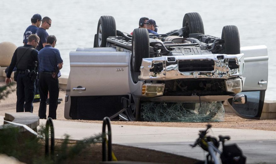 Police spokesman Lt. Mike Pooley said 27-year-old Glenn Edward Baxter purposefully drove himself, his estranged wife and their children into Tempe Town Lake just after midnight Sunday. (Associated Press)