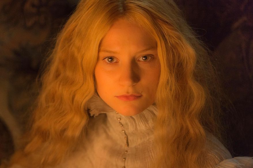 In this image released by Legendary Pictures and Universal Pictures, Mia Wasikowska, appears in a scene from the film, "Crimson Peak." (Kerry Hayes/Legendary Pictures and Universal Pictures via AP)