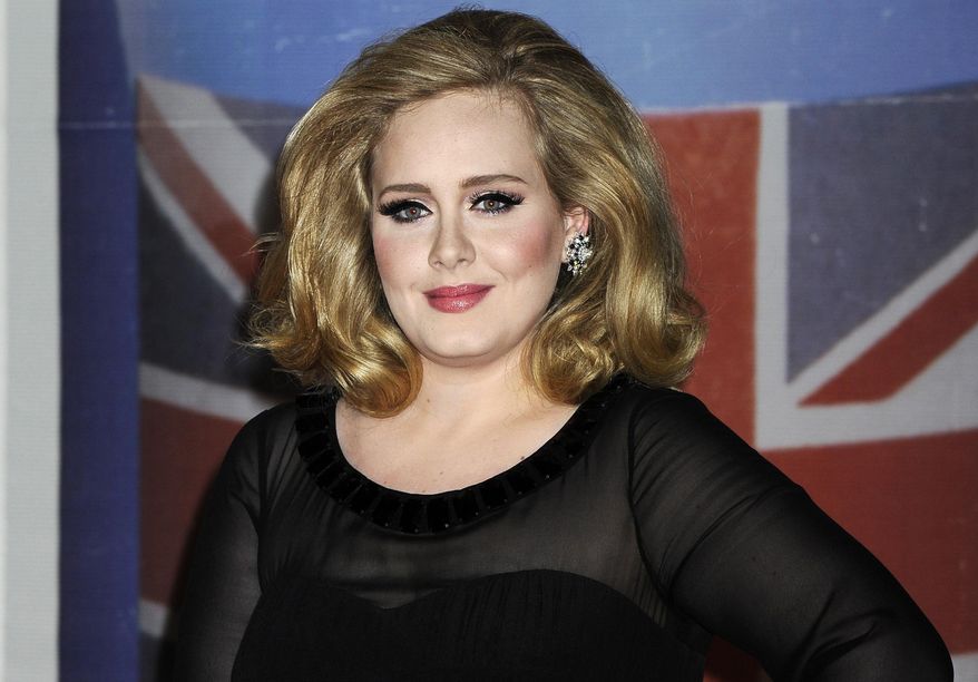 Performer Adele arrives for the Brit Awards 2012 at the O2 Arena in London, in this Feb. 21, 2012, file photo. (AP Photo/Jonathan Short, File)