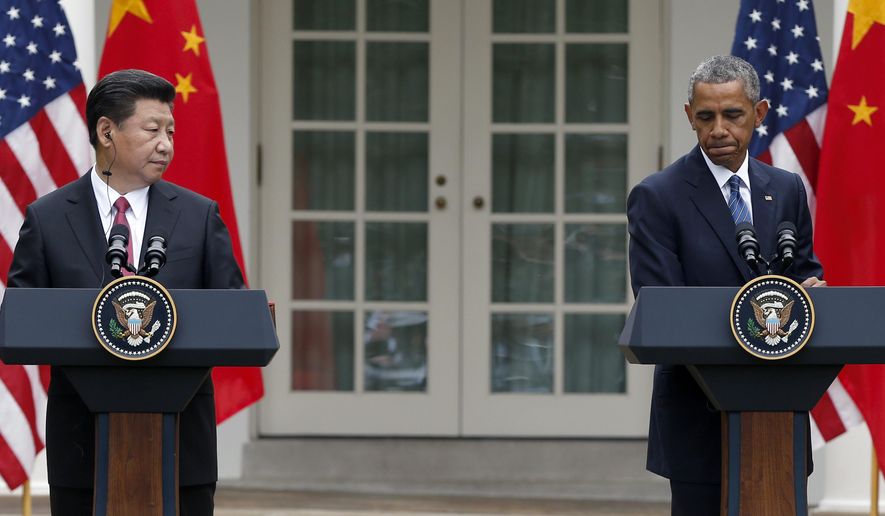 President Obama, right, pauses during a joint news conference with Chinese President Xi Jinping in the Rose Garden of the White House in Washington on Sept. 25, 2015. (Associated Press) **FILE**