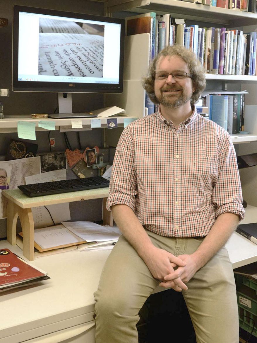 Damian Flemiing, professor of Medieval studies, linguistics and Latin at IPFW is photographed on Oct. 6, 2015 in Fort Wayne, Ind. Fleming will give a presentation about his summer research titled "Lurking in the Archives: Unexpected Hebrew in the Bodleian Library, Oxford" for the Anthropology Club Luncheon Lecture series. (Michelle Davies /The Journal-Gazette via AP) NEWS-SENTINEL OUT; MANDATORY CREDIT; NO SALES; MAGS OUT