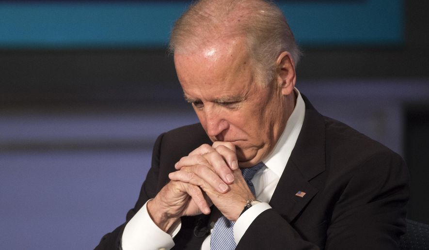 Vice President Joe Biden pauses at George Washington University in Washington, Tuesday, Oct. 20, 2015, during a forum to honor the legacy of former Vice President Walter Mondale. (AP Photo/Molly Riley)