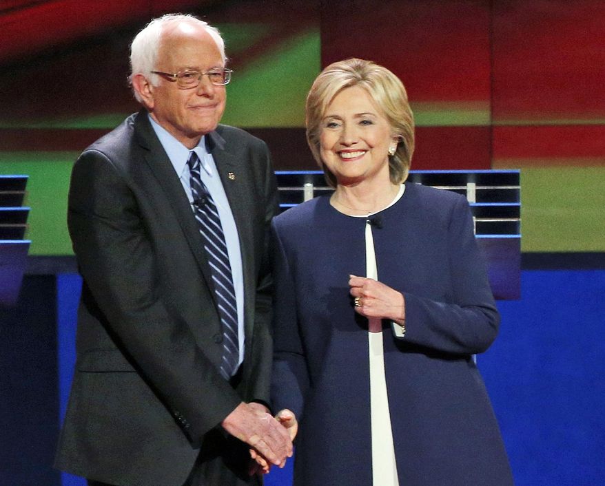 Democratic presidential candidates Sen. Bernie Sanders, I-Vt., left, and Hillary Rodham Clinton talk before the CNN Democratic presidential debate in Las Vegas, in this Oct. 13, 2015, file photo. (AP Photo/John Locher) ** FILE **