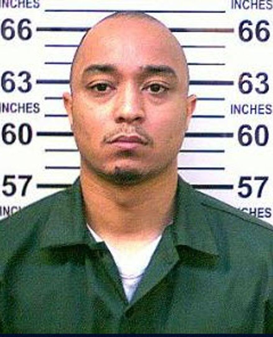 This 2014 photo provided by the New York Department of Corrections shows Tyrone Howard who is in police custody as the suspect in the killing of New York City Police Department Officer Randolph Holder, who was shot dead Tuesday night, Oct. 21, 2015 during an exchange of gunfire in East Harlem. Howard, in police custody Wednesday, had been arrested 20 times for offenses ranging from drug possession to robbery, had been sentenced to state prison twice since 2007 on separate drug possession and sale convictions, state records show. (New York Department of Corrections via AP)