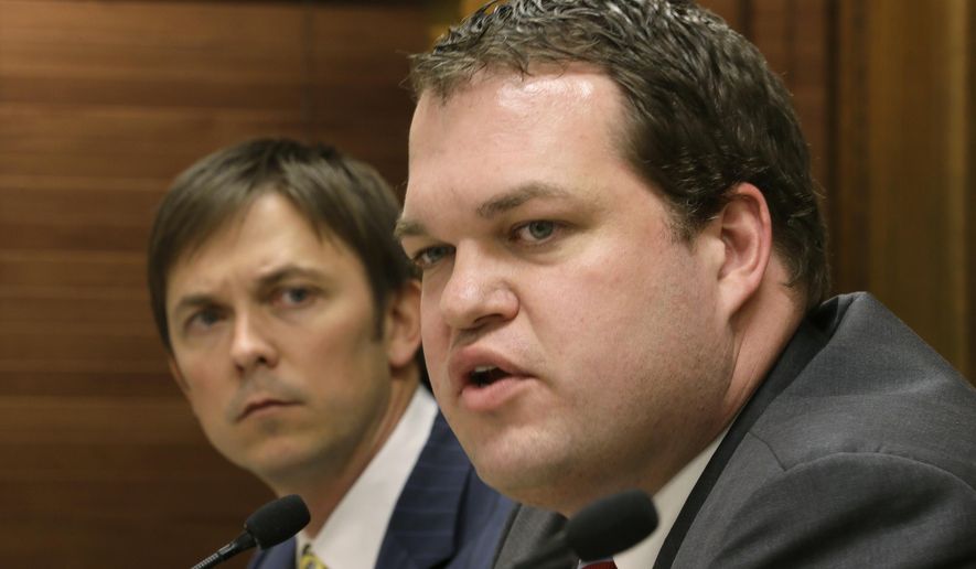 FILE - In a Jan. 7, 2013 file photo, Sen. Michael Lamoureux, R-Russellville, right, responds to a reporter's question about the upcoming legislative session as Rep. Davy Carter, R-Cabot, listens at the Arkansas state Capitol in Little Rock, Ark. While leading the Arkansas Senate, former Sen. Michael Lamoureux, now the governor’s chief of staff, received $120,000 in consulting fees from a political nonprofit that was largely funded by some of the state’s top lobbying firms and their clients, according to tax documents obtained by The Associated Press. (AP Photo/Danny Johnston, File)