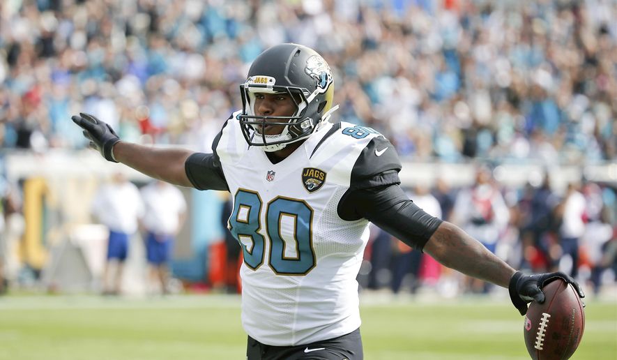 Jacksonville Jaguars tight end Julius Thomas (80) celebrates his touchdown after he made a catch against the Houston Texans on a pass play during the second half of an NFL football game in Jacksonville, Fla., Sunday, Oct. 18, 2015. (AP Photo/Stephen B. Morton)