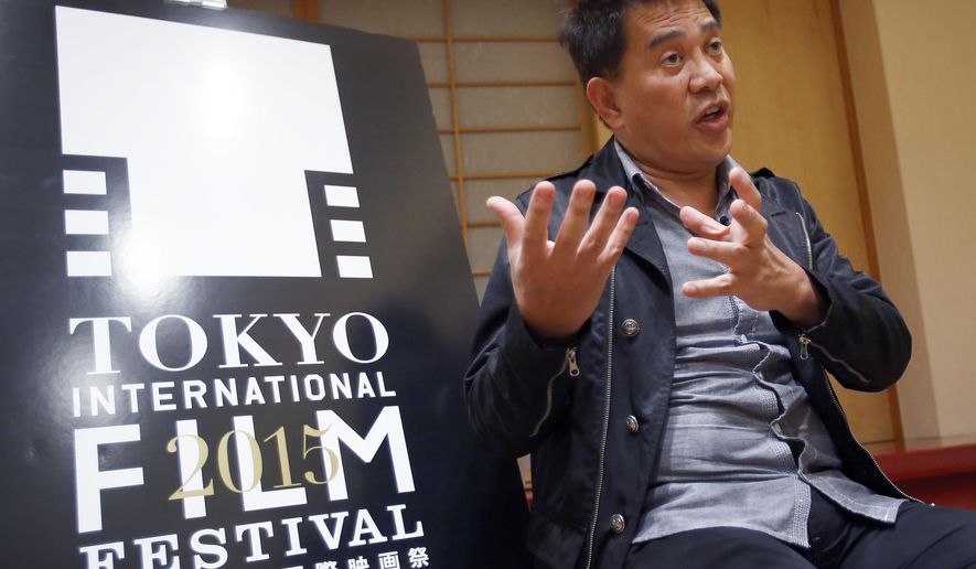 In this photo taken Wednesday, Oct. 21, 2015, Filipino director Brillante Mendoza speaks during an interview in Tokyo. Mendoza, taking center stage at the Tokyo International Film Festival, is pursuing a collaboration with other Asian filmmakers - a cultural connection that might be as simple as rice. (AP Photo/Shizuo Kambayashi)