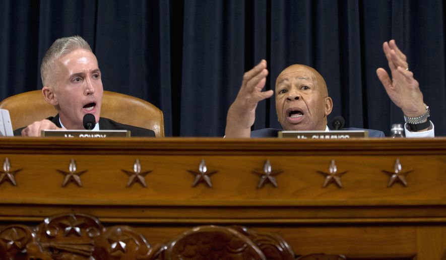 House Benghazi Committee Chairman Rep. Trey Gowdy, R-S.C., left, and the committee&#39;s ranking member Rep. Elijah Cummings, D-Md., have a heated discussion on the dais on Capitol Hill in Washington, Thursday, Oct. 22, 2015, as Democratic presidential candidate, former Secretary of State Hillary Rodham Clinton testified before the committee. (AP Photo/Carolyn Kaster)