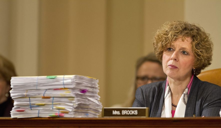 In this file photo, House Benghazi Committee member Rep. Susan W. Brooks, R-Ind., listens behind a stack of papers as Democratic presidential candidate, former Secretary of State Hillary Rodham Clinton, testifies on Capitol Hill in Washington, Thursday, Oct. 22, 2015, before the committee&#x27;s hearing on Benghazi. (AP Photo/Jacquelyn Martin) **FILE**