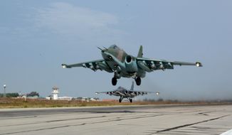 Russian Su-25 jets takes off for a mission from Hemeimeem airbase, Syria, on Thursday, Oct. 22, 2015. Since early morning, Russian combat jets have been taking off from this base in western Syria, heading for missions. (AP Photo/Vladimir Kondrashov) 2