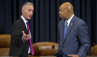 House Benghazi Committee Chairman Rep. Trey Gowdy, R-S.C., left, talks with the committee&#39;s ranking member Rep. Elijah Cummings, D-Md. on Capitol Hill in Washington, Thursday, Oct. 22, 2015, prior to the start of the committee&#39;s hearing on Benghazi. After months of buildup, Hillary Rodham Clinton finally takes center stage as the star witness in the Republican-led investigation into the deadly 2012 attacks in Benghazi, Libya. (AP Photo/Evan Vucci)