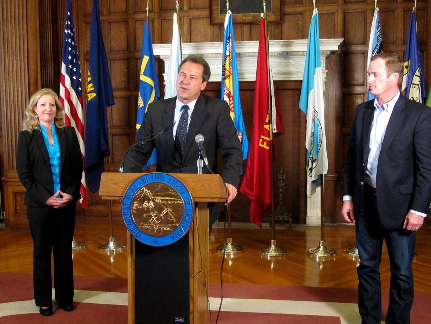 Montana Gov. Steve Bullock (center), Jamie Ryan Lockman (left) of Kamut International and Errol Rice of the Montana Stockgrowers Association discuss an upcoming trade mission to South Korea and Taiwan during a press conference in Helena on Oct. 22, 2015. (Associated Press) **FILE**