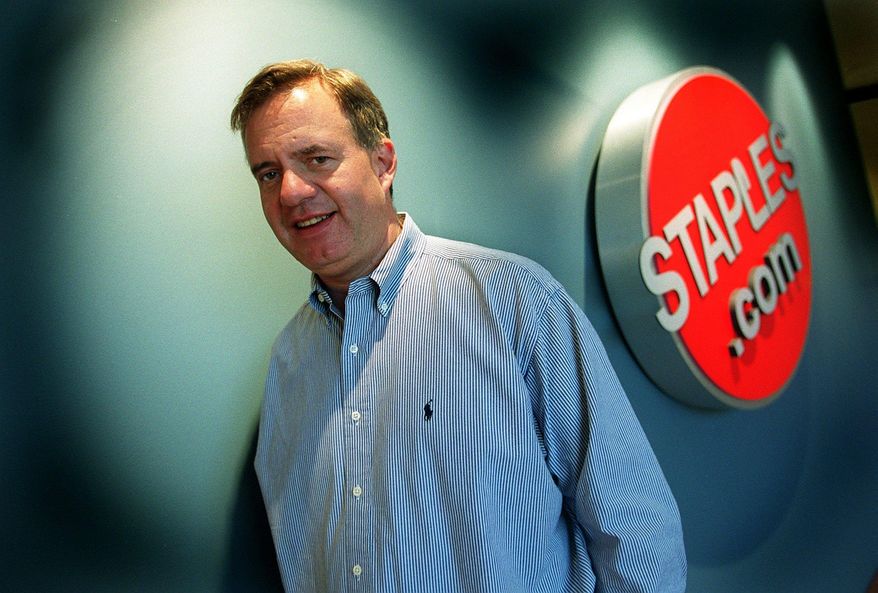 In this photo taken May 4, 2000, Thomas Stemberg, the founder of Staples, poses for a photo outside the Staples.com offices in Framingham, Mass. Stemberg, a former grocery business executive who founded Staples Inc. and revolutionized the office supplies retail business, died Friday, Oct. 23, 2015, at his home in Massachusetts. He was 66. (Pam Berry/The Boston Globe via AP) BOSTON HERALD OUT, QUINCY OUT; NO SALES; MANDATORY CREDIT