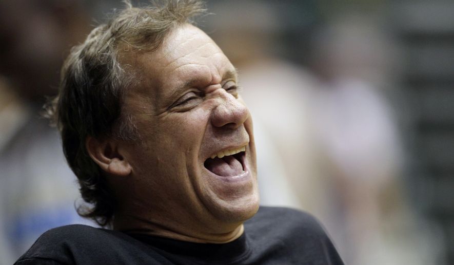 FILE - In this Sept. 29, 2010, file photo, Washington Wizards coach Flip Saunders laughs during NBA basketball training camp at the Patriot Center at George Mason University in Fairfax, Va. Saunders, the longtime NBA coach who won more than 650 games in nearly two decades and was trying to rebuild the Minnesota Timberwolves as team president, coach and part owner, died Sunday, Oct. 25, 2015, the team said. He was 60. (AP Photo/Carolyn Kaster, File)