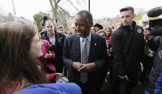 In this Oct. 24, 2015, photo, Republican presidential candidate Dr. Ben Carson greets audience members after speaking at Iowa State University in Ames, Iowa. Seven in 10 Republican and Republican-leaning registered voters say Donald Trump could win the November 2016 election. That compares to 6 in 10 who say the same for retired neurosurgeon Carson, who, like Trump, has tapped into the powerful wave of anti-establishment anger defining the early phases of the 2016 contest. (AP Photo/Charlie Neibergall, File)