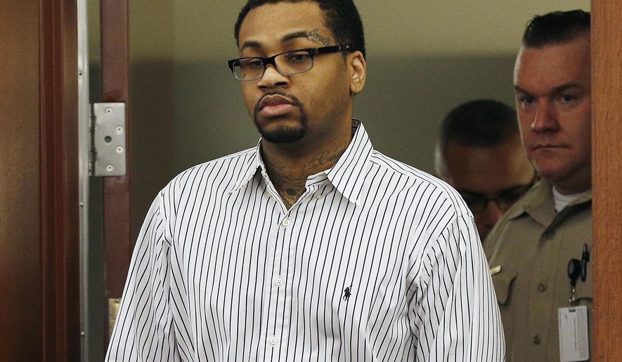 FILE - In this Monday, Oct. 12, 2015 file photo, Ammar Harris walks into court in Las Vegas. Harris was found guilty on Monday of killing three people in a shooting and fiery crash on the Las Vegas Strip in February 2013. Harris sat still and gave no reaction as the verdicts were read in Clark County District Court. (AP Photo/John Locher, File)