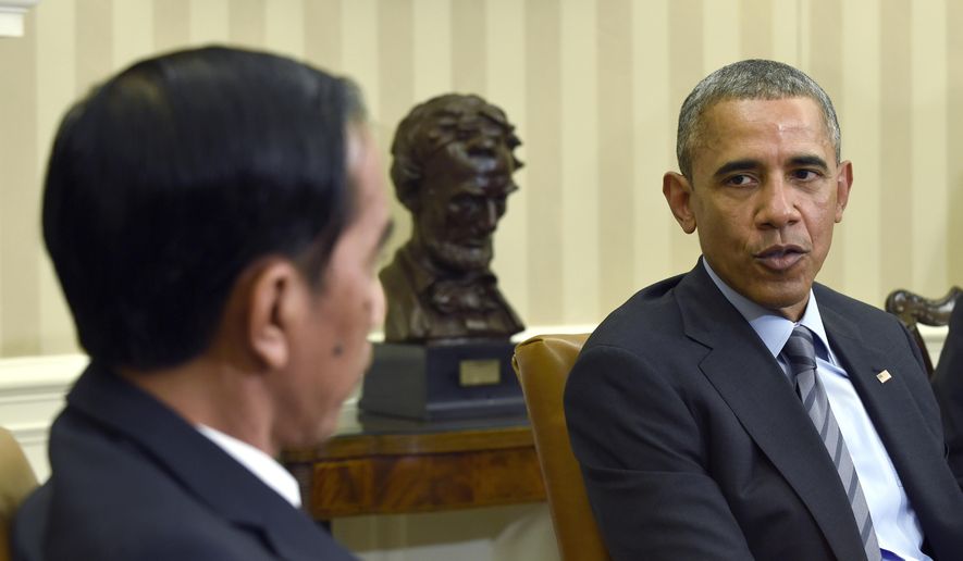President Barack Obama meets with Indonesian President Joko Widodo in the Oval Office of the White House in Washington, Monday, Oct. 26, 2015. This is Widodo&#x27;s first visit to the U.S.  since becoming President of Indonesia. (AP Photo/Susan Walsh)