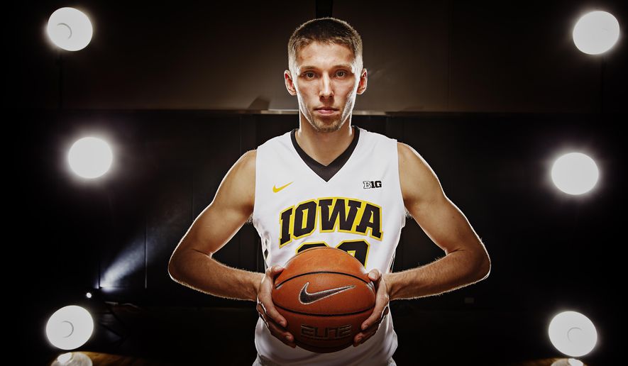 FILE - In this Oct. 7, 2015, file photo, Iowa senior forward Jarrod Uthoff poses for a portrait during NCAA college basketball media day in Iowa City, Iowa. The Hawkeyes are now expected to play deep into March _ and they could again this season if senior Jarrod Uthoff fulfills his potential.  (Brian Powers/The Des Moines Register via AP, File)  MAGS OUT, TV OUT, NO SALES, MANDATORY CREDIT