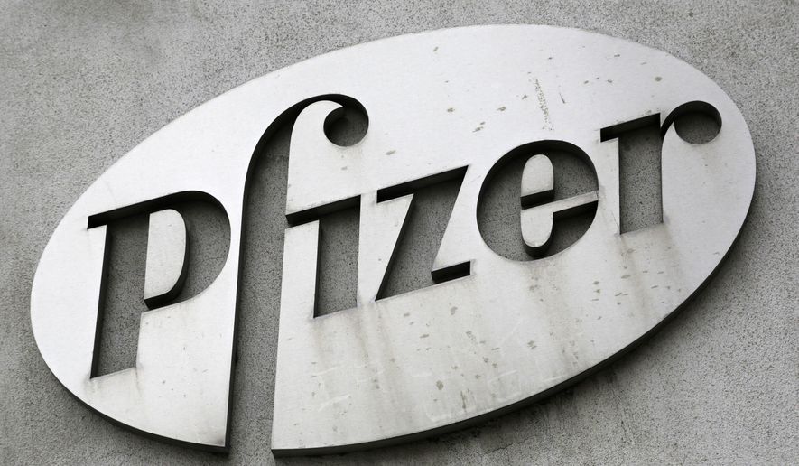 FILE - In this May 4, 2014 file photo, the Pfizer logo is displayed on the exterior of a former Pfizer factory in the Brooklyn borough of New York. Pfizer reports quarterly financial results on Tuesday, Oct. 27, 2015.  (AP Photo/Mark Lennihan, File)