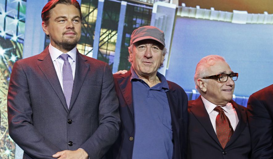 From left, film stars Leonardo DiCaprio, Robert De Niro and director Martin Scorsese pose for photos during a launching ceremony of the Studio City project in Macau, Tuesday, Oct. 27, 2015. China&#39;s world-beating gambling hub is getting a taste of Hollywood glamor as its newest casino resort makes its debut on Tuesday with a glitzy grand opening that masks turmoil behind the scenes. (AP Photo/Kin Cheung)