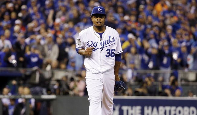 Kansas City Royals pitcher Edinson Volquez reacts after getting New York Mets&#x27; David Wright out to end the third inning of Game 1 of the Major League Baseball World Series Tuesday, Oct. 27, 2015, in Kansas City, Mo. (AP Photo/David J. Phillip)