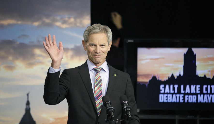 FILE - In this Oct. 8, 2015, file photo, Mayor Ralph Becker waves during a Salt Lake City mayoral debate with former state Rep. Jackie Biskupski at the studios of KUED-TV in Salt Lake City. The tightest race in the country’s most conservative state this year is a close battle between two Democrats, Biskupski and Becker, in a liberal stronghold —the Salt Lake City mayor’s race. (AP Photo/Rick Bowmer, file)