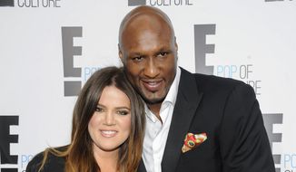 In this April 30, 2012, file photo, Khloe Kardashian Odom and Lamar Odom from the show &quot;Keeping Up With The Kardashians,&quot; attend an E! Network upfront event at Gotham Hall in New York. (AP Photo/Evan Agostini, File)