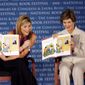 In this Sept. 27, 2008, file photo, first lady Laura Bush, right, and her daughter Jenna Bush Hager read their book &quot;Read All About It!&quot; during the National Book Festival in Washington. HarperCollins Publishers said Thursday, Oct. 29, 2015, that the Bushes are collaborating with illustrator Jacqueline Rogers on “Our Great Big Backyard.” (AP Photo/Jose Luis Magana)